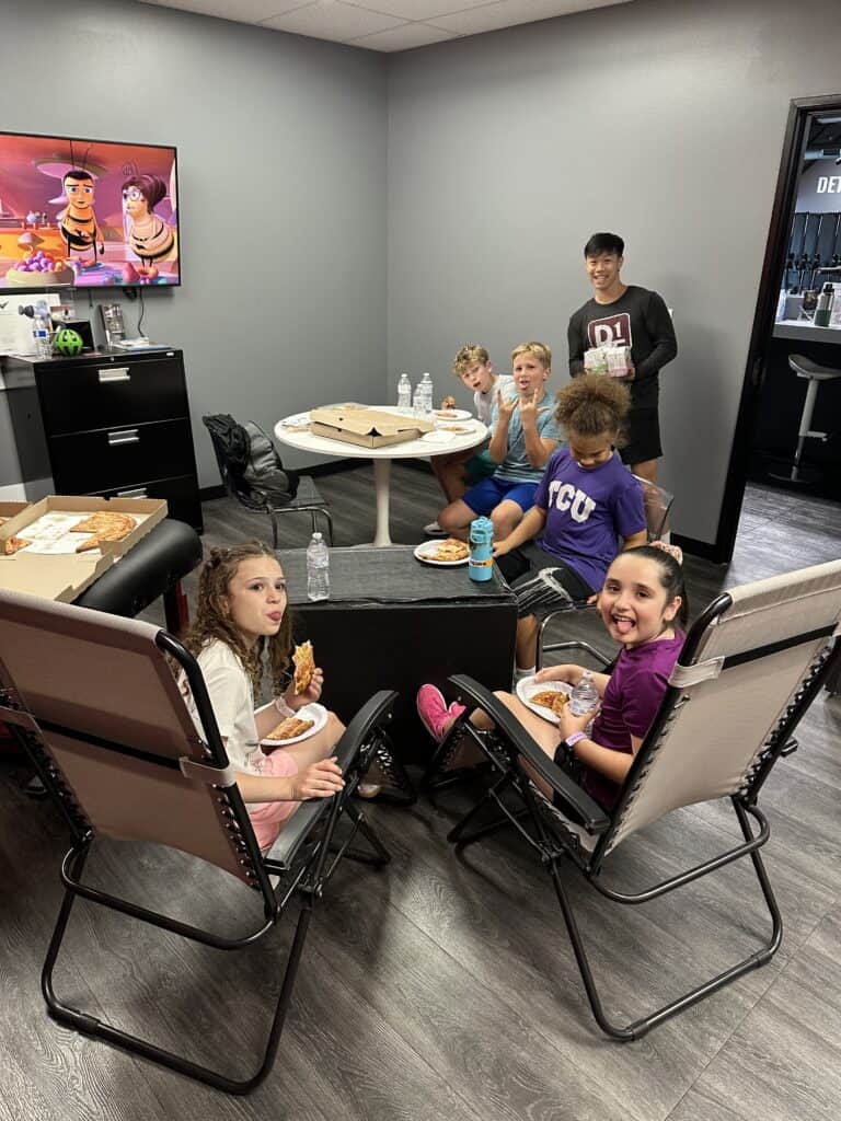 Kids enjoying pizza at the Parents’ Night Out Pizza & Hydration Break